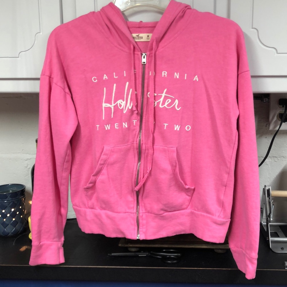 HOLLISTER Pink zip up hoodie size medium embroidered Hollister on front